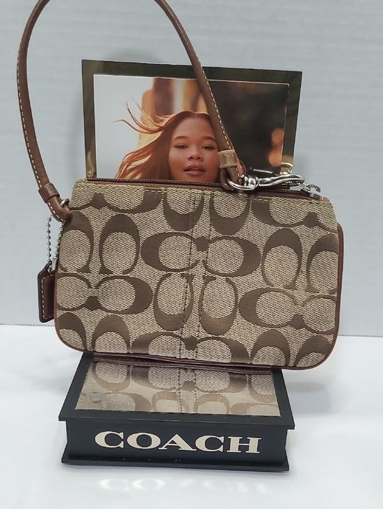 Coach Handbags - Coach Brown and Beige Signature Canvas Wristlet